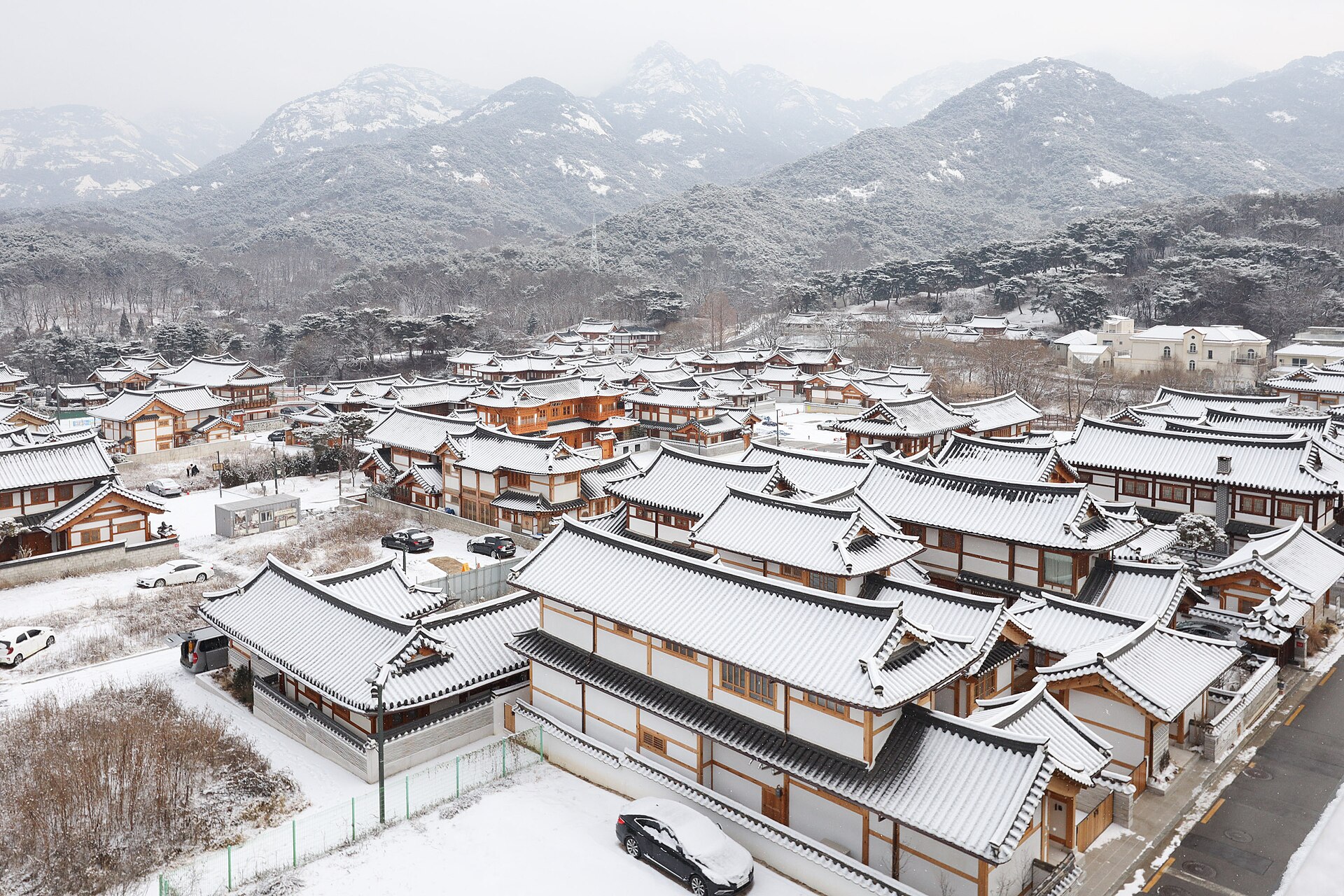 Snow-covered Eunpyeong Hanok Village and Bukhansan Mountain in winter